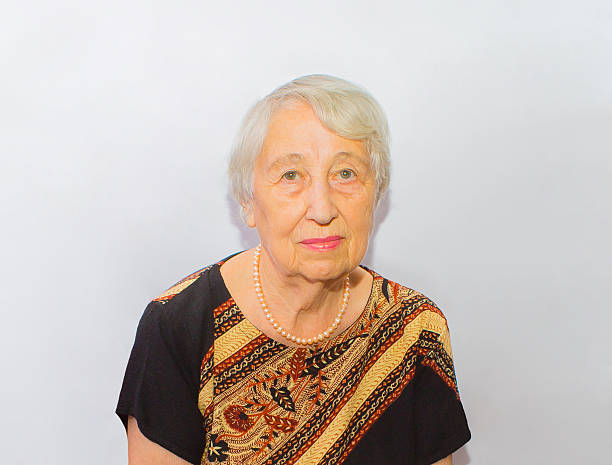 istock Old woman face portrait, aging process concept 598099994