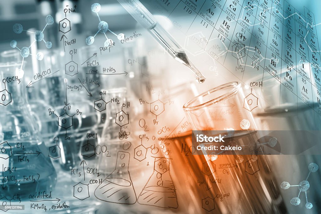 Science/Chemical Concept researcher dropping the clear reagent into test tube with periodic table and chemical equations background, for reaction testing in chemical laboratory. Chemistry Stock Photo