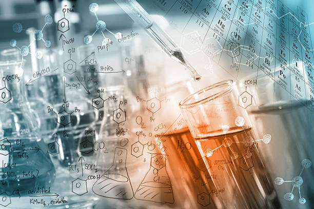 Science/Chemical Concept researcher dropping the clear reagent into test tube with periodic table and chemical equations background, for reaction testing in chemical laboratory. laboratory glassware stock pictures, royalty-free photos & images