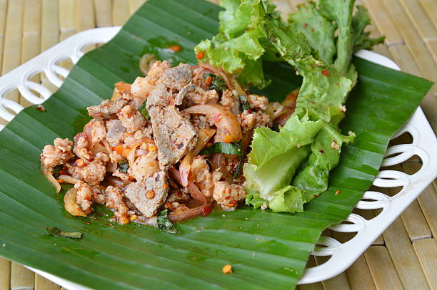 istock spicy minced pork salad on banana leaf 598131748