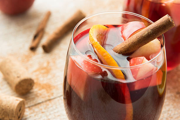 Winter sangria with citrus, apples and cinnamon Homemade delicious red sangria with oranges and apples sangria stock pictures, royalty-free photos & images
