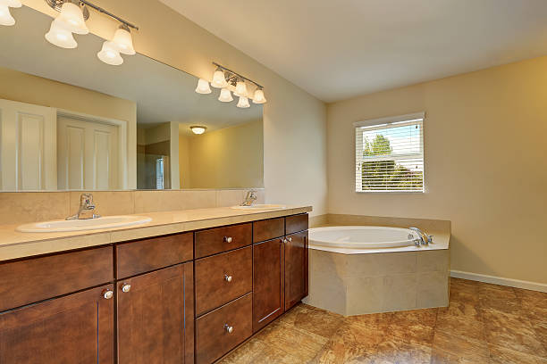 istock Great bathroom interior with corner bath tub and marble floor 598132742