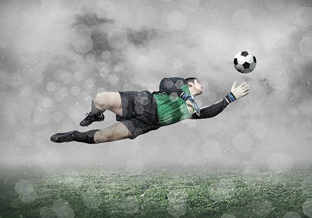 istock Football player with ball in action under sky with clouds 598133352