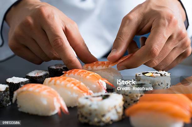 Chef Preparing Sushi Stock Photo - Download Image Now - Sushi, Chef, Preparation