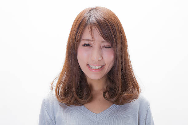 istock Japanese woman winking 598134246