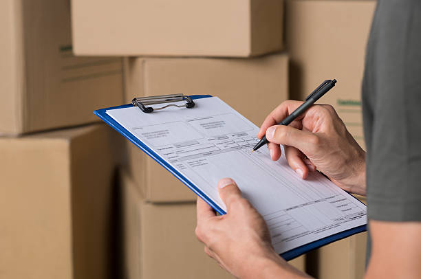 operator in warehouse working - distribution warehouse freight transportation messenger box imagens e fotografias de stock