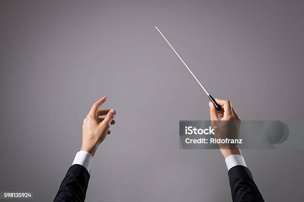 Musician Directing Concert Stock Photo - Download Image Now - Musical Conductor, Directing, Classical Music