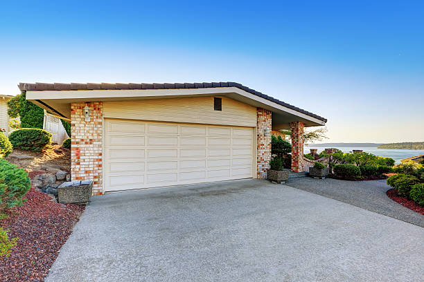 istock House exterior. Garage with concrete driveway 598136296
