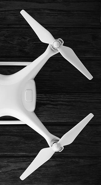 istock quadrocopter on a black wooden background 598140790