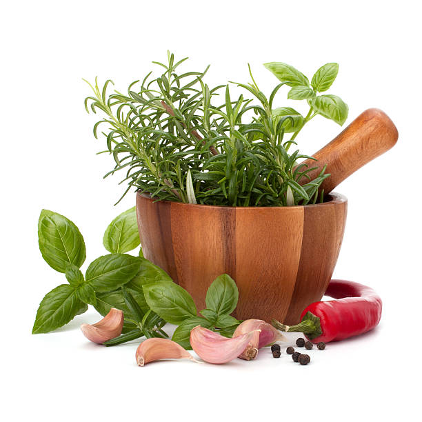 istock fresh flavoring herbs and spices in wooden mortar 598140944