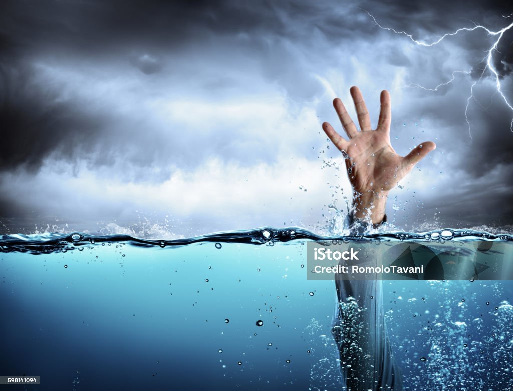 Help Concept - Drowning And Failure Man’s Hand In Sea And Storm Drowning Stock Photo