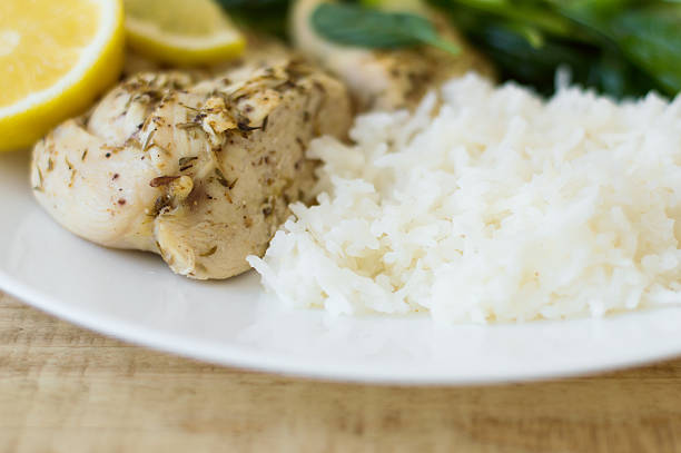 istock White rice, baked chicken breasts with thyme and lemon 598141126