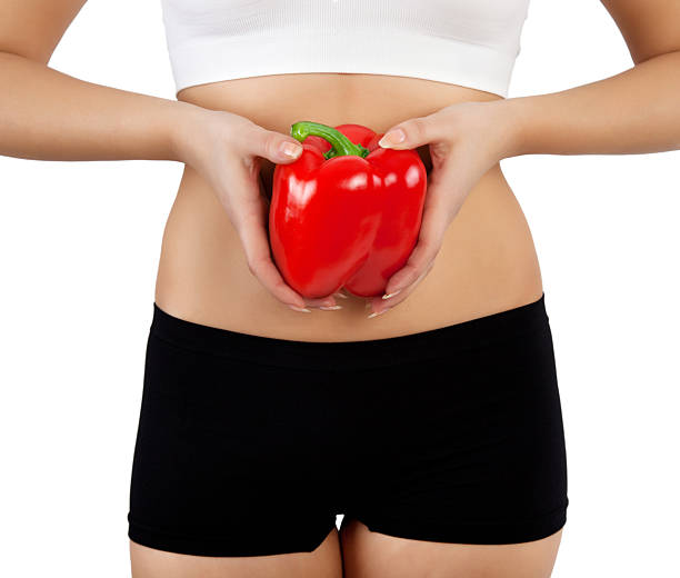 istock woman holding red bell pepper 598142206