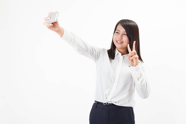 istock Japanese businesswoman taking a selfie 598143338