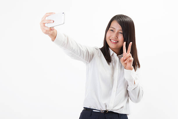 istock Japanese businesswoman taking a selfie 598143370