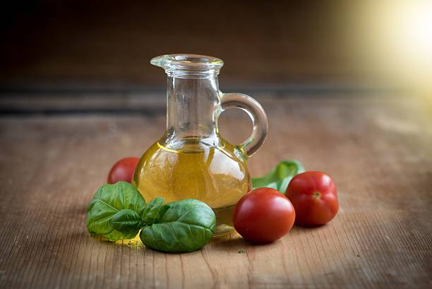 Fresh Basil Leaves and Tomatoes  with olive oil stock photo