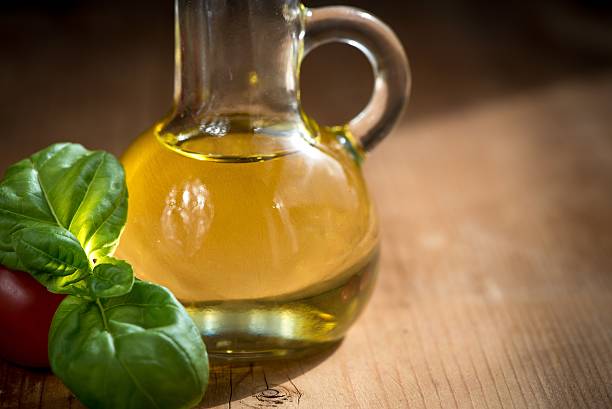 Fresh Basil Leaves and Tomatoes  with olive oil stock photo