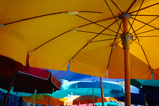 Colorful umbrellas in cafe near the beach