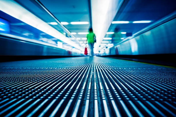 istock Moving blue travolator in airport 598147828
