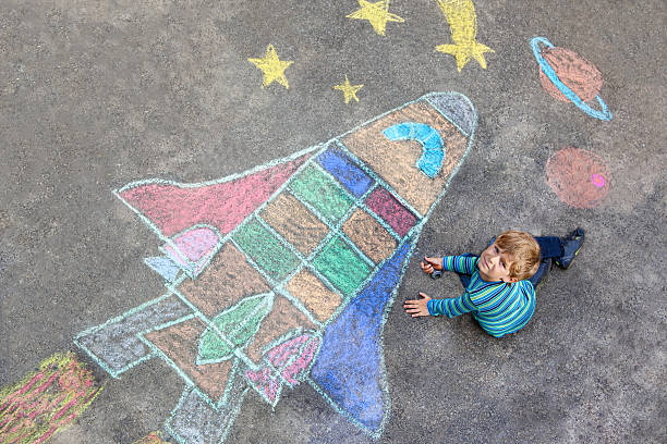 istock little kid boy flying by a space shuttle chalks picture 598148176