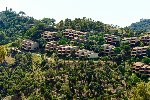 Modern hillside suburban houses in Cala Giverola. Tossa de Mar, Province of Girona. Spain