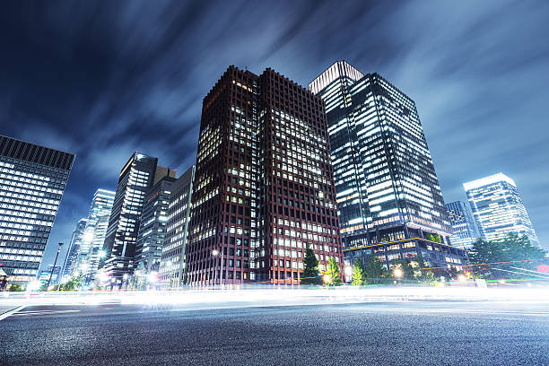 skyscrapers with busy traffic at night