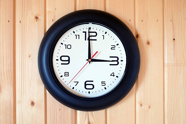 istock Big round wall clock isolated on wooden wall 598150000