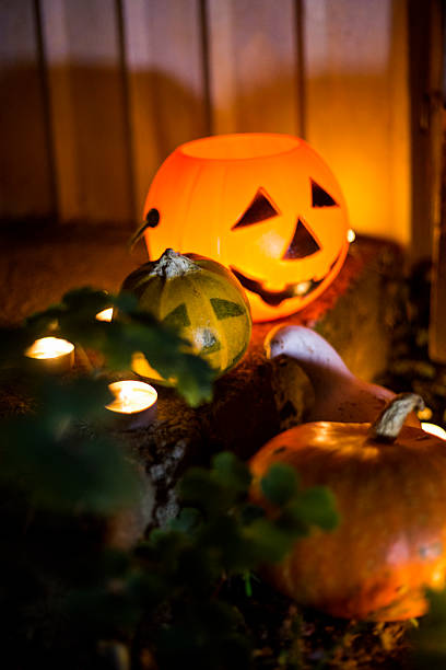 istock Halloween pumpkin head jack lantern on wooden background 598151518