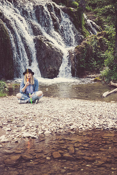 istock Girl in front of a waterfall. 598152010