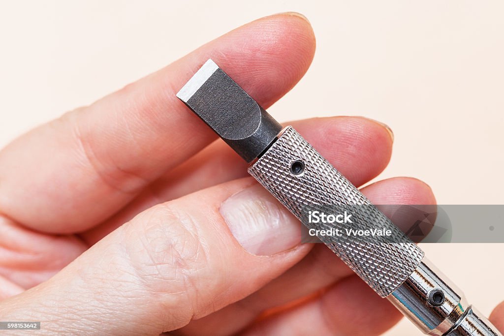 Blade Of Swivel Knife On Fingers Close Up Stock Photo - Download Image Now  - Adjustable, Adult, Art And Craft - iStock
