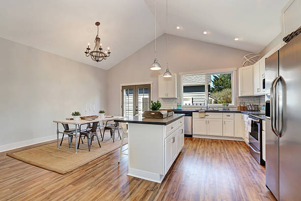 istock Interior of kitchen and dining room with high vaulted ceiling. 598154560