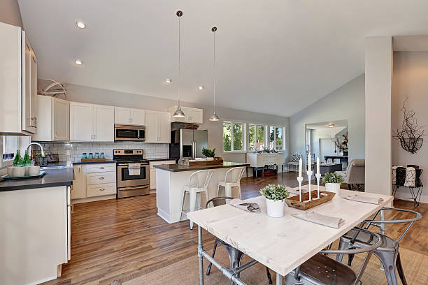 istock Interior of kitchen and dining room with high vaulted ceiling. 598154882
