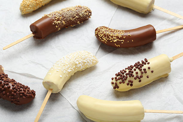 istock Banana covered in chocolate on a pergament 598157558