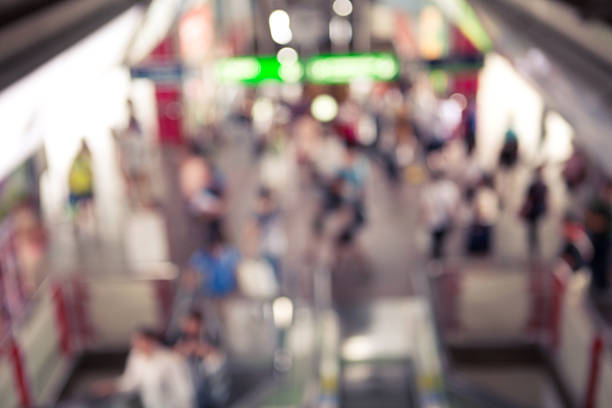 istock Abstract blurred background many of people walking and standing 598157772