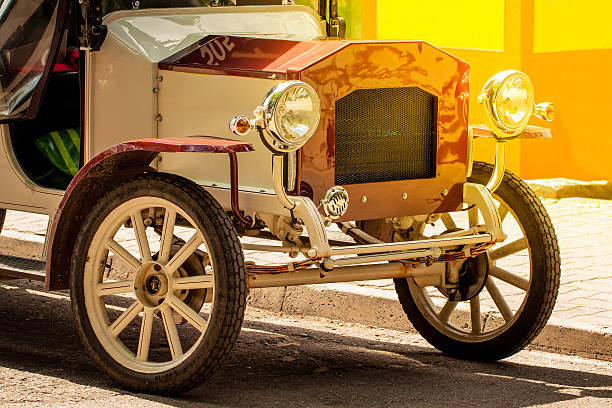 istock Front of old vintage car with shining bumper and reflector. 598158174