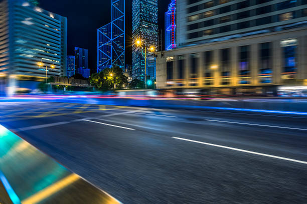 istock light trails on street, hong kong 598158504
