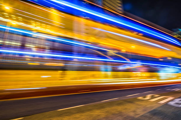 istock light trails on street, hong kong 598159204