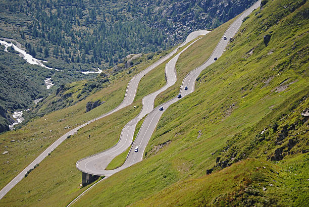 Traffic on the Furka pass Traffic one the the Furka pass between Realp and Gletsch grimsel pass photos stock pictures, royalty-free photos & images