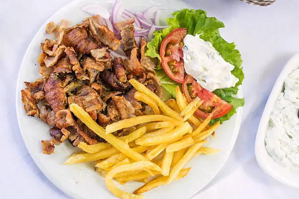 Gyros portion served on a table in a restaurant, view from above