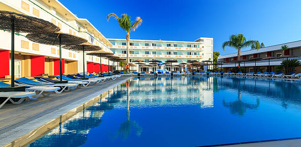istock Space by pool with sun loungers and childrens playground 598160810