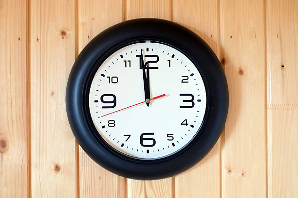 istock Big round wall clock isolated on wooden wall 598161406