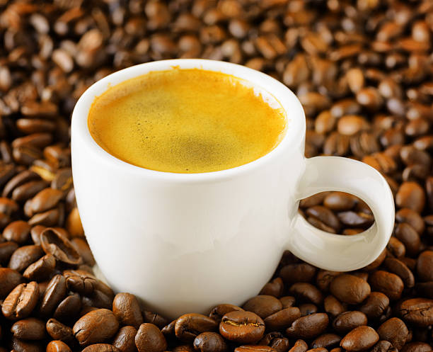 istock Cup of espresso in coffee beans 598161912