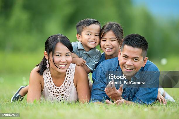 Family Portrait At The Park Stock Photo - Download Image Now - Asian and Indian Ethnicities, Family, Lifestyles