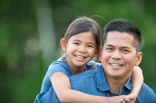 istock Father and Daughter Hanging Out at the park 598162662