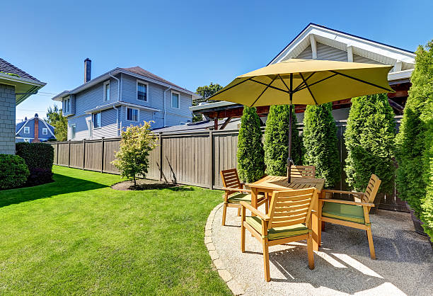 istock Small Patio area with wooden table set and umbrella. 598163858