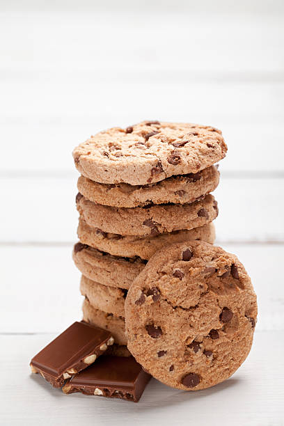 istock Cookies tower and chocolate on old white table 598164438