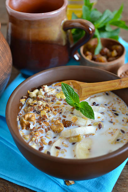 istock Granola with milk, walnuts and a banana for breakfast 598165540