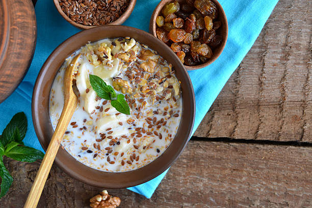 istock Granola with milk, walnuts and a banana for breakfast 598165760