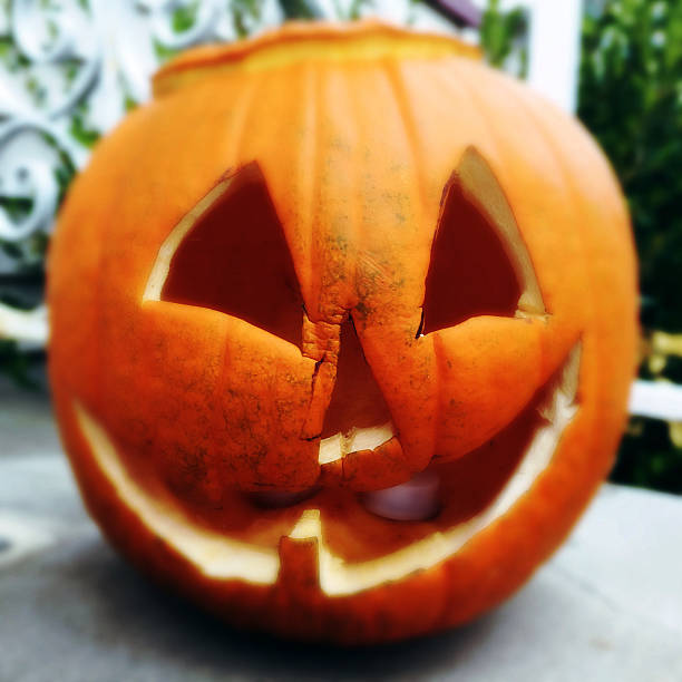 istock Rotting halloween jackolantern pumpkin, filtered effect 598167654