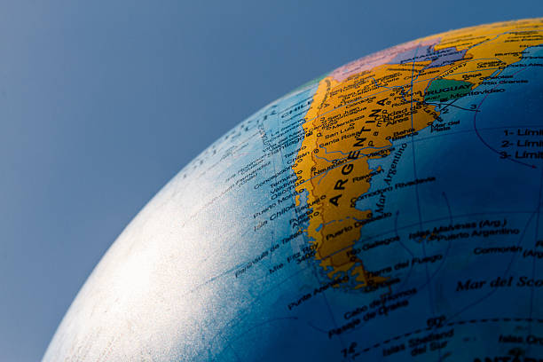 Globe with political division illuminated with sunlight and blue